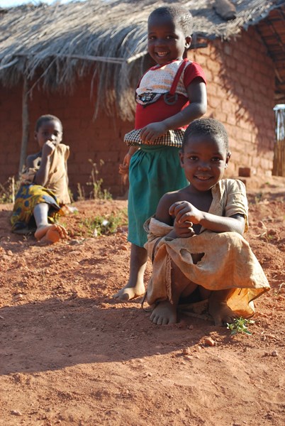 Children play while mothers attend HIV awareness group.jpg